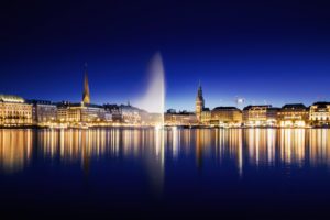 Promenade on Jungfernstieg is reflected in the Alster at the blue hour,Hamburg,Germany Promenade on Jungfernstieg is reflected in the Alster at the blue hour,Hamburg,Germany